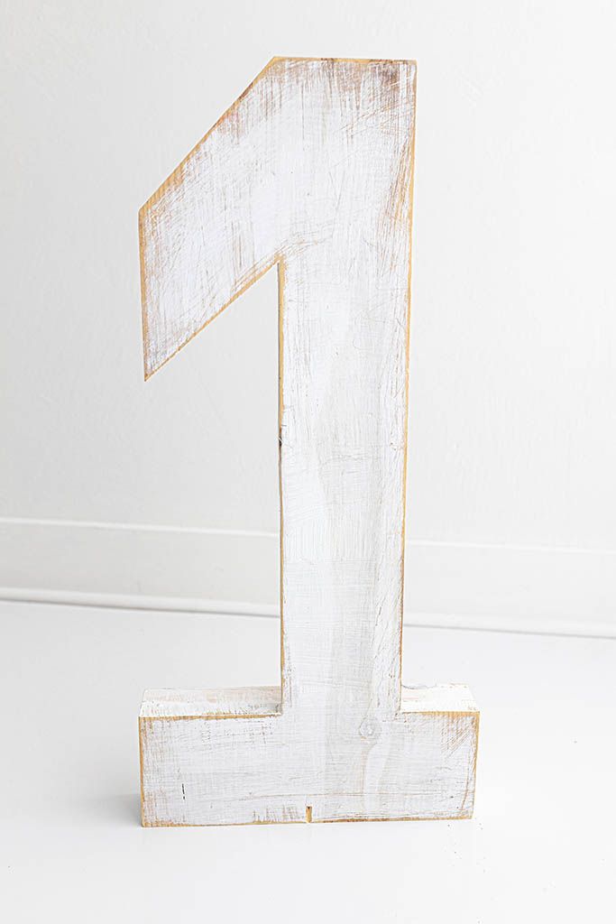 Rustic whitewashed number 1 sign on a white background; Prop for cake Smash Photographer in Temecula, California.
