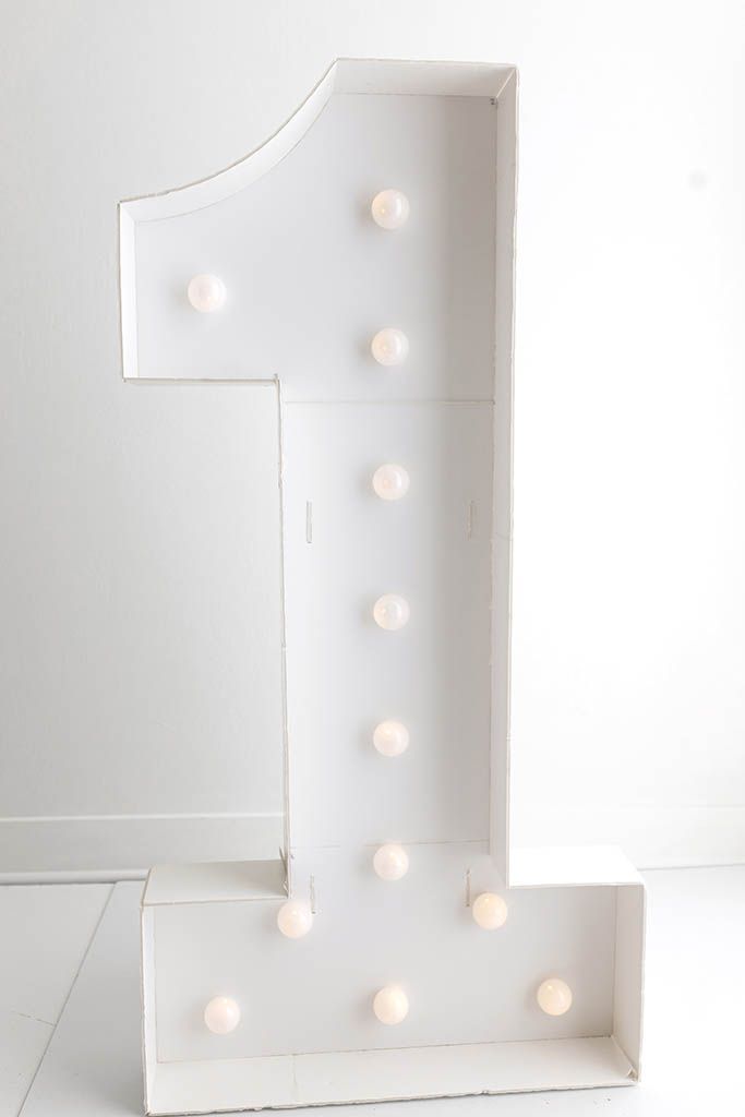 Large white marquee light-up number one; Menifee-based newborn and baby photographer specializing in first birthday and cake smash sessions.