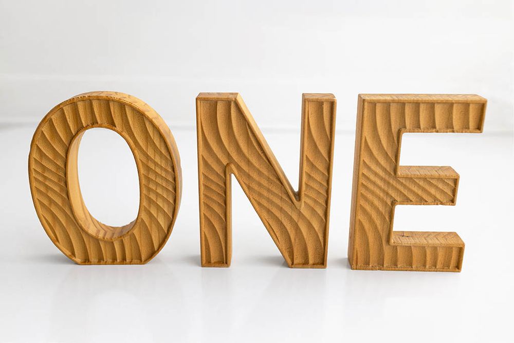 Textured wooden letters spelling ONE; Baby Photographer in Menifee, CA.