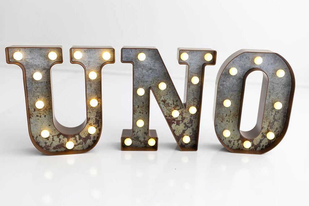 Rustic vintage marquee UNO light up letters for baby's first birthday photos; Menifee, California cake smash photographer.