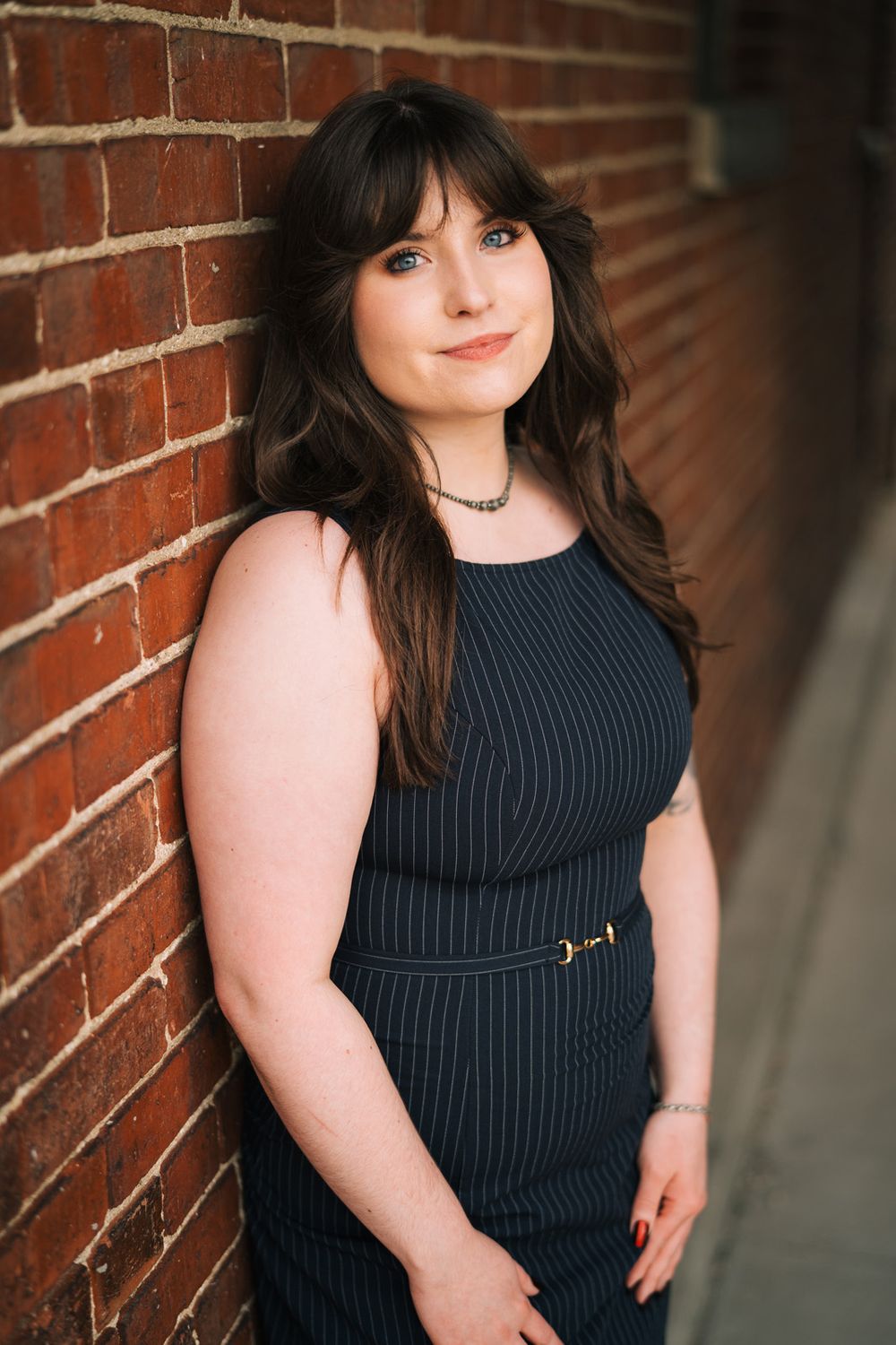 Graduation portraits downtown Lockport, Illinois. Copyright Two Birds Photography 2026