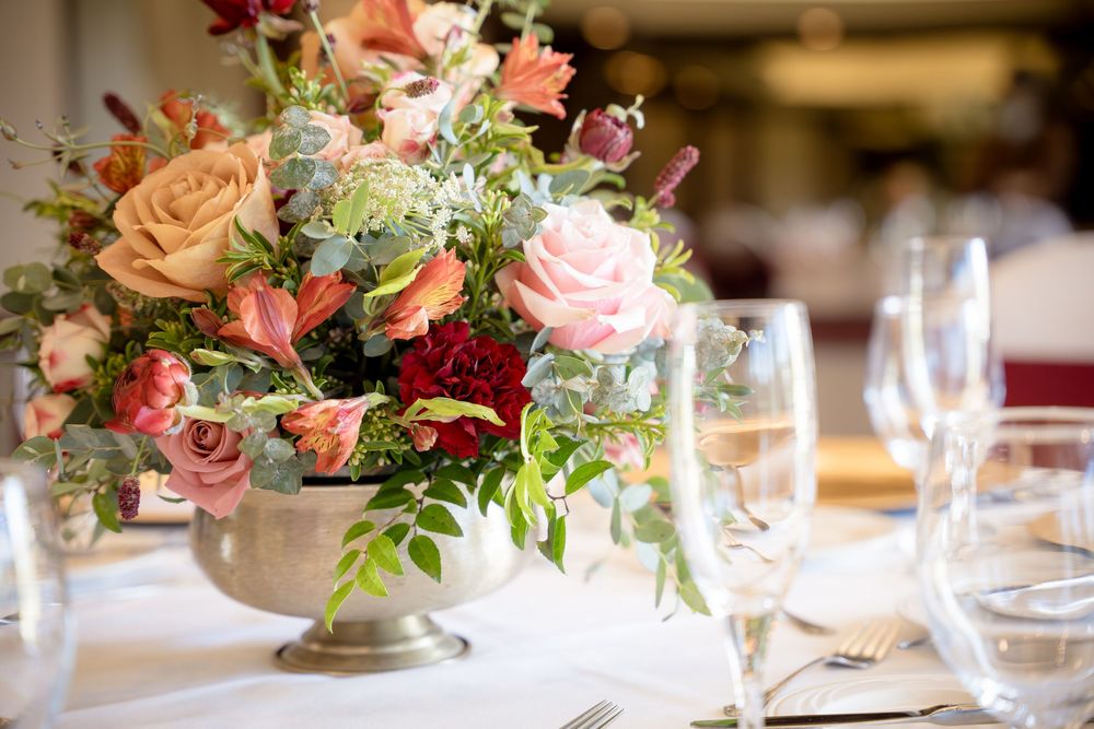 Flower center piece at Yolo Fliers Club in Woodland, California. Photo by Ashley Nicole Baeza, Woodland Wedding Photographer.