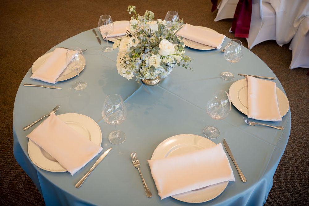 Light blue wedding table decor at Yolo Fliers Club in Woodland, California. Photo by Ashley Nicole Baeza, Woodland Wedding Photographer.
