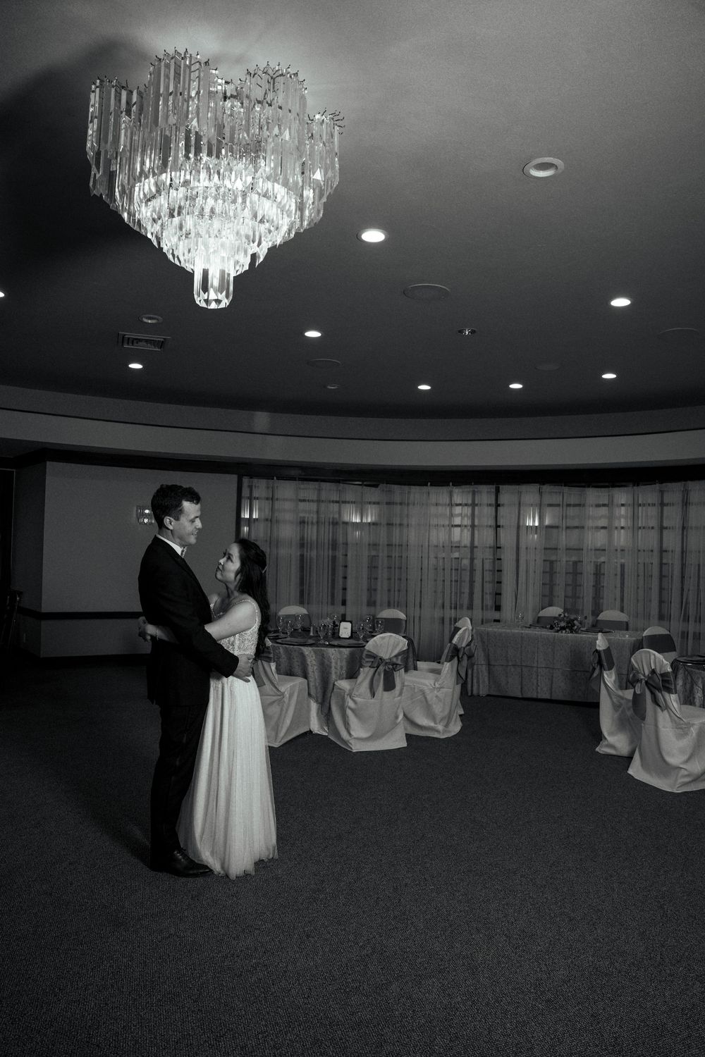 Bride and groom dancing at the Yolo Fliers Club in Woodland, California. Photo by Ashley Nicole Baeza, Woodland wedding photographer.