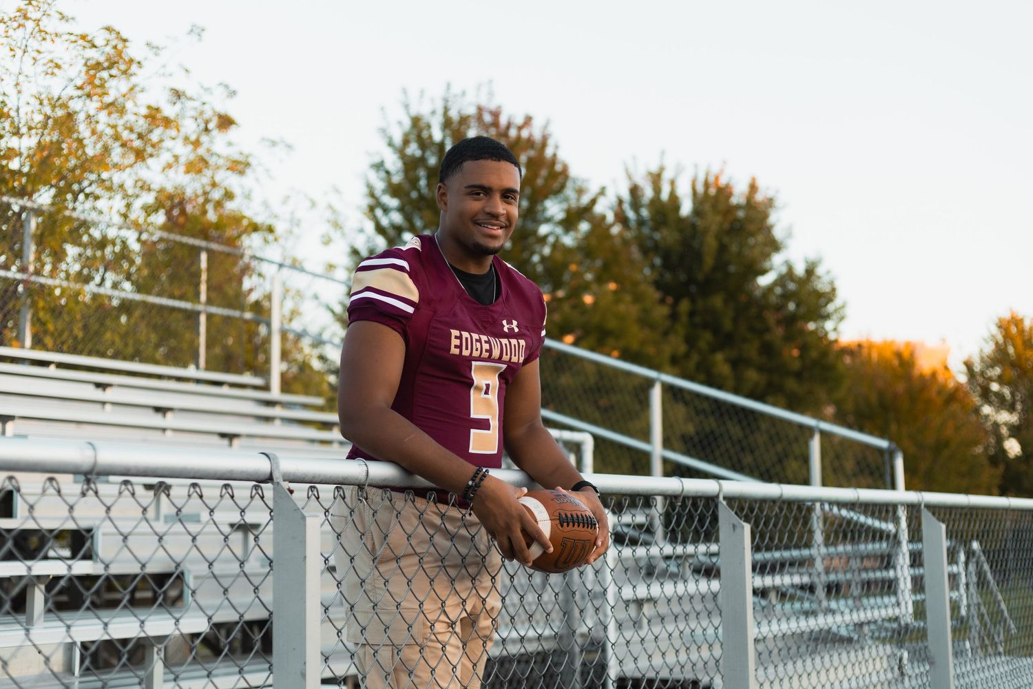 madison wi professional high school senior photographer what to wear outfit inspiration photos football player sports logo edgewood college
