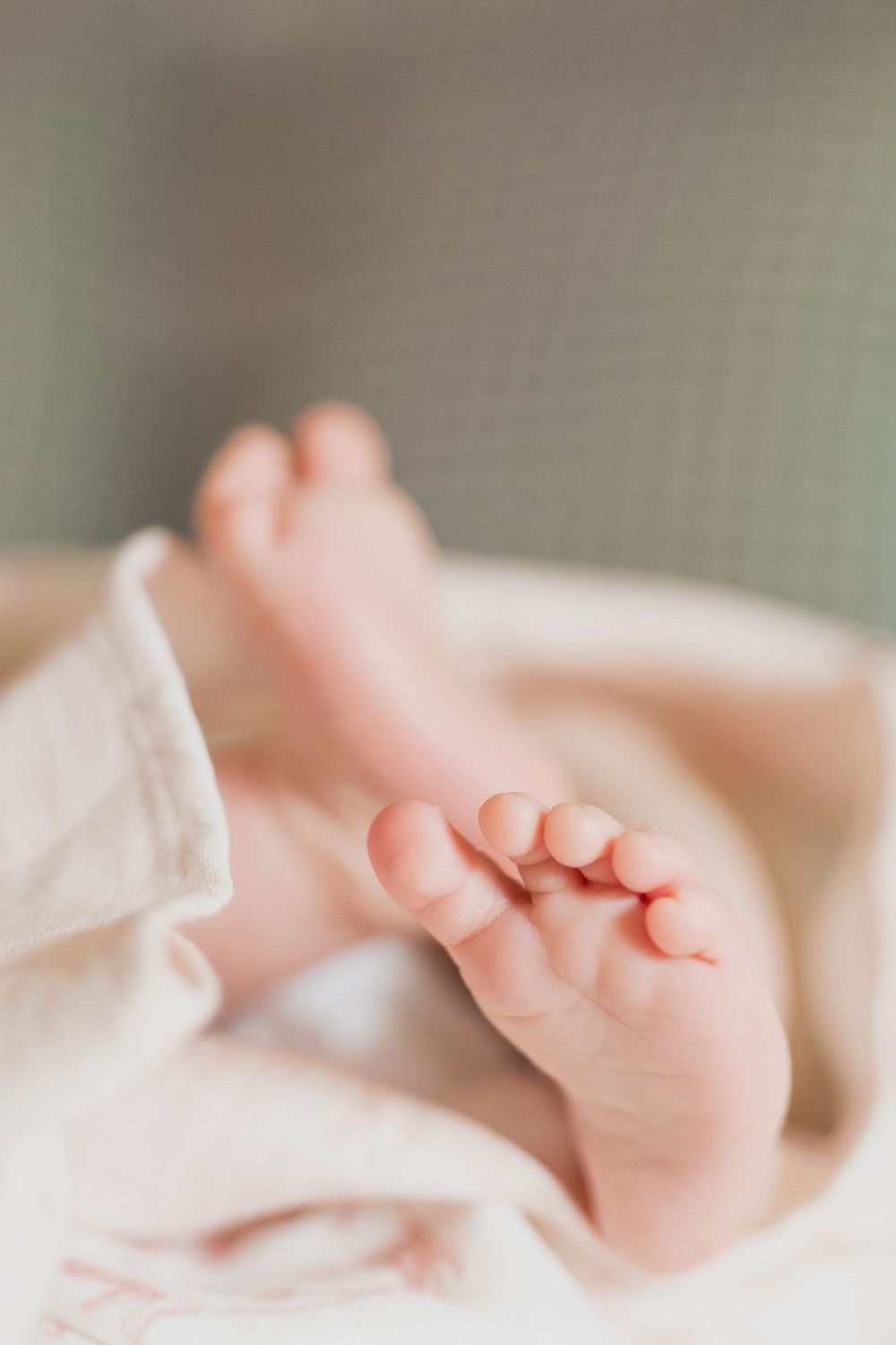 baby girl in the crib newborn photos