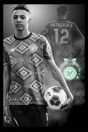 Soccer player in geometric patterned PYSL jersey with number 12 Pataskala on back holding ball in black and white photo.