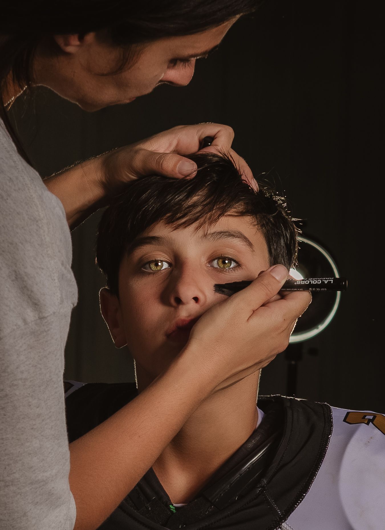 Lincoln, Alabama youth football photographer capturing behind-the-scenes game day preparation.