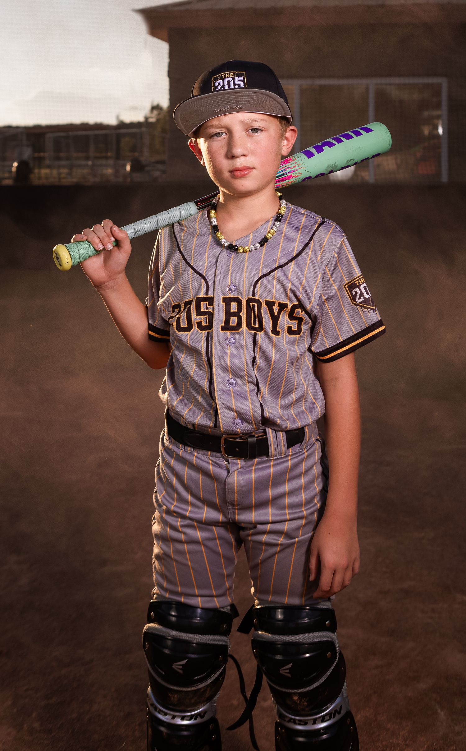 Lincoln, Alabama youth baseball sportrait featuring a player in full uniform with catcher's gear and bat.