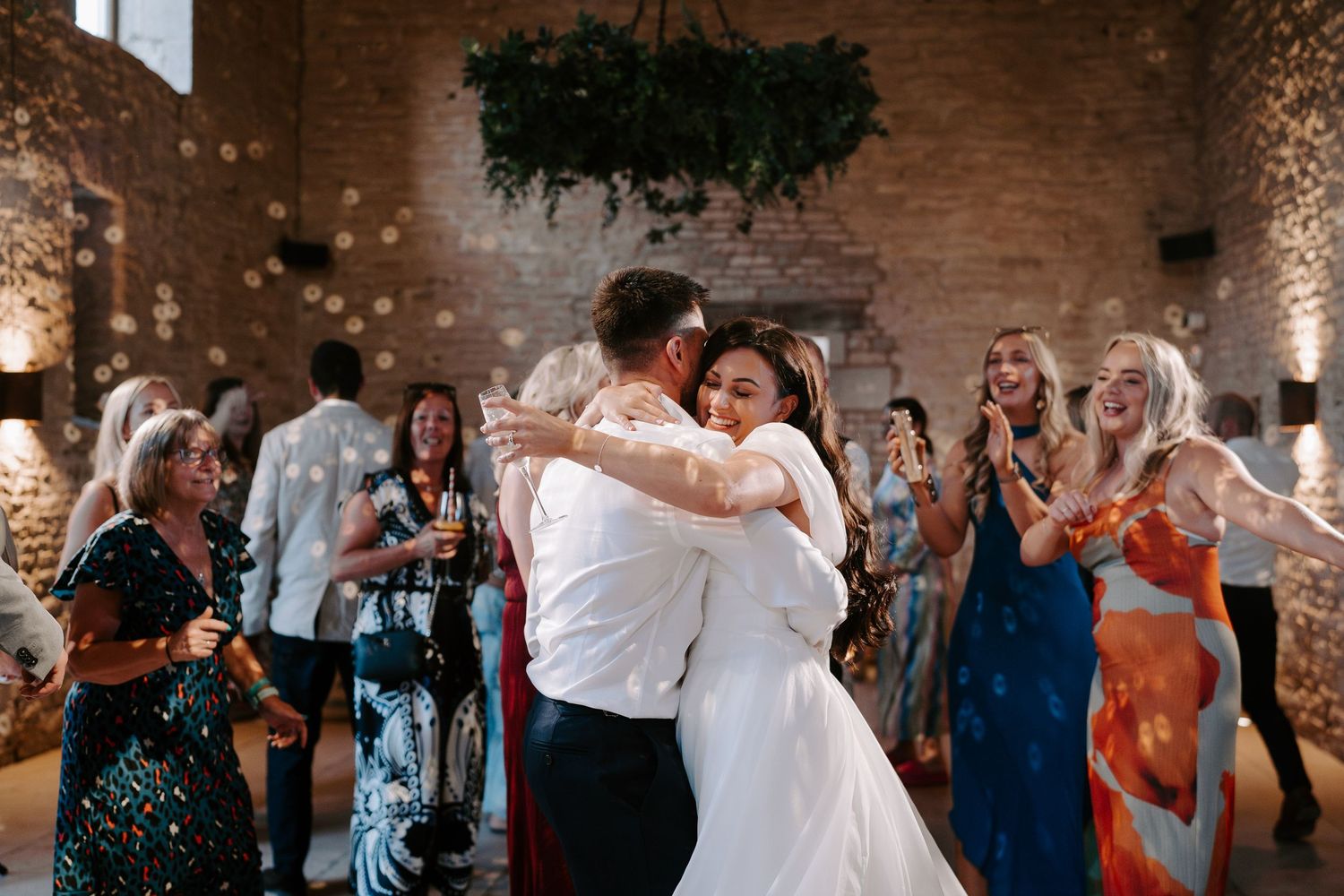 bride and groom dancing at yardspace old gore in cirencester