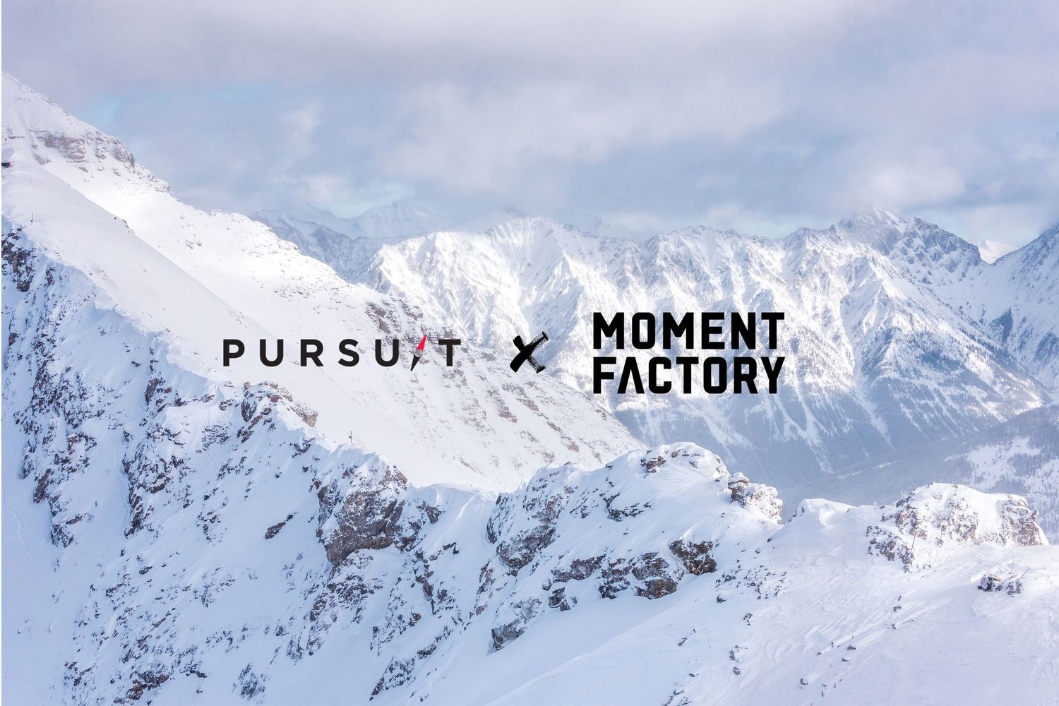 Snow covered mountain peaks with text overlays reading 'Pursuit x Moment Factory' against a winter landscape.