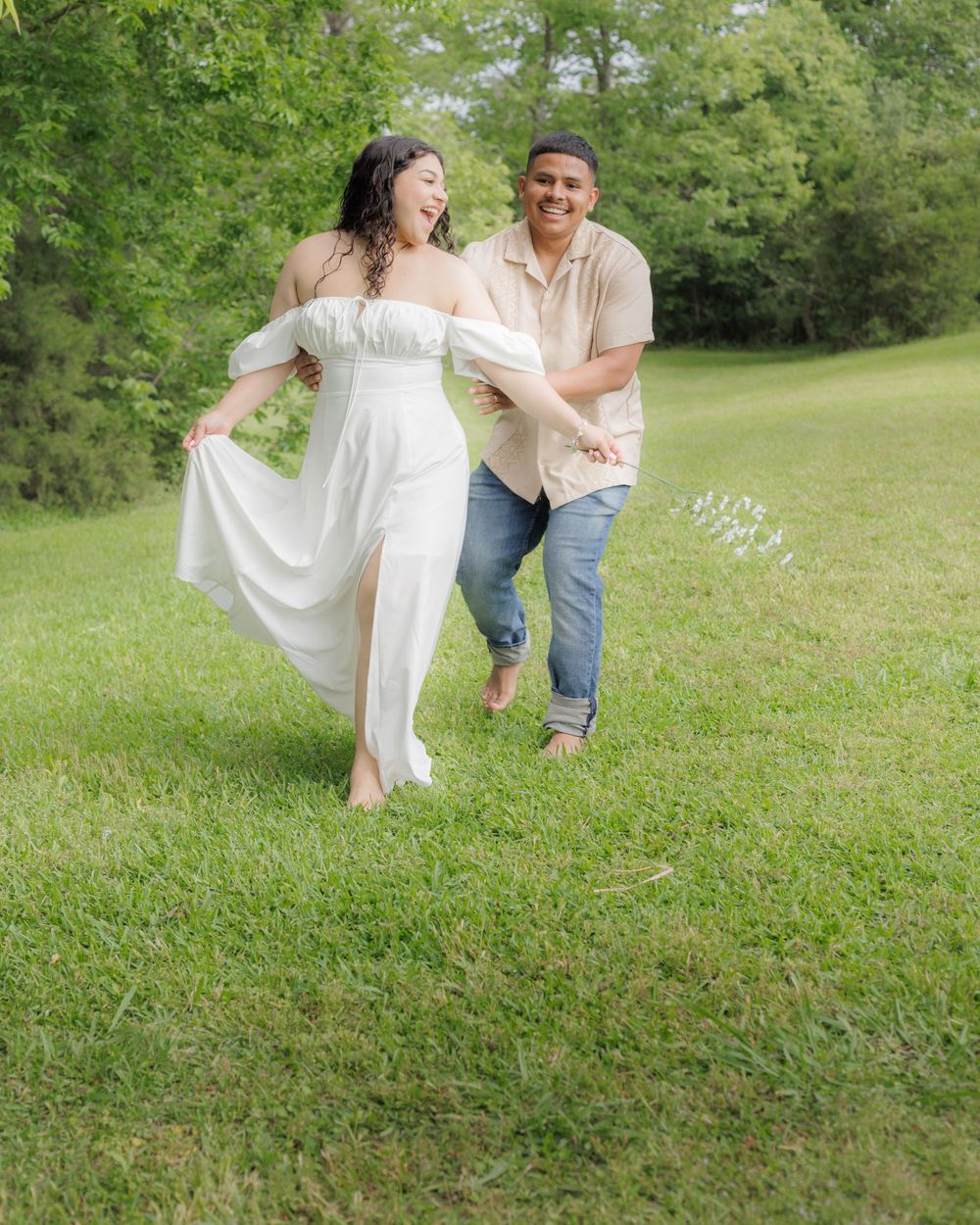Outdoor session where the husband is playing catch with his beloved wife.