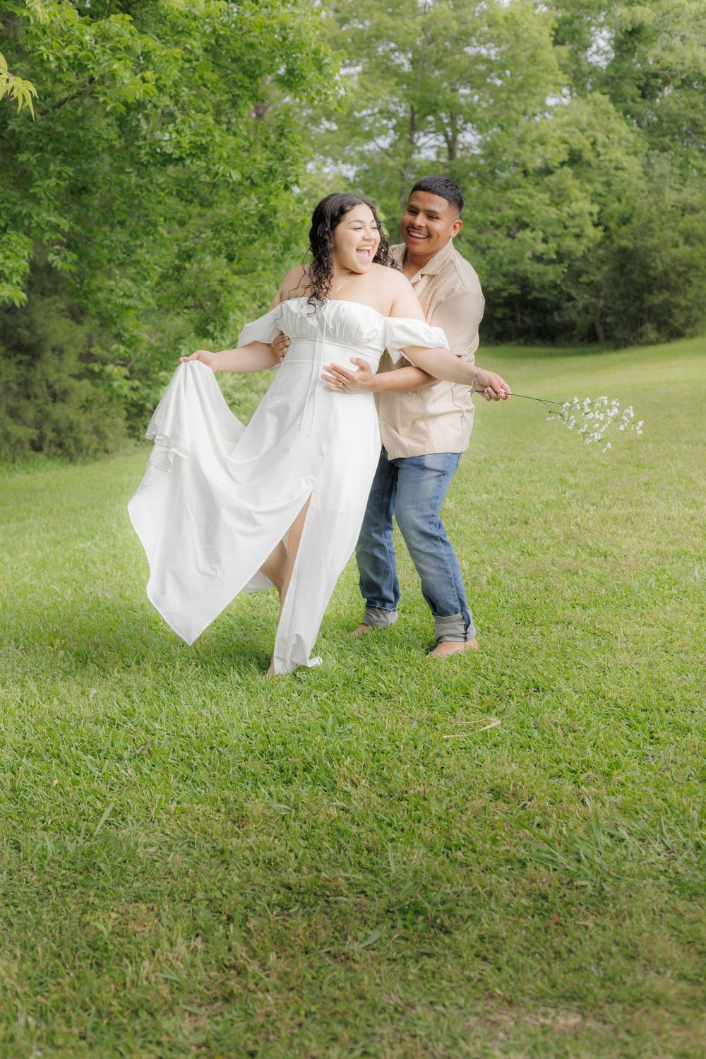 Outdoor session where the husband is playing catch with his beloved wife.