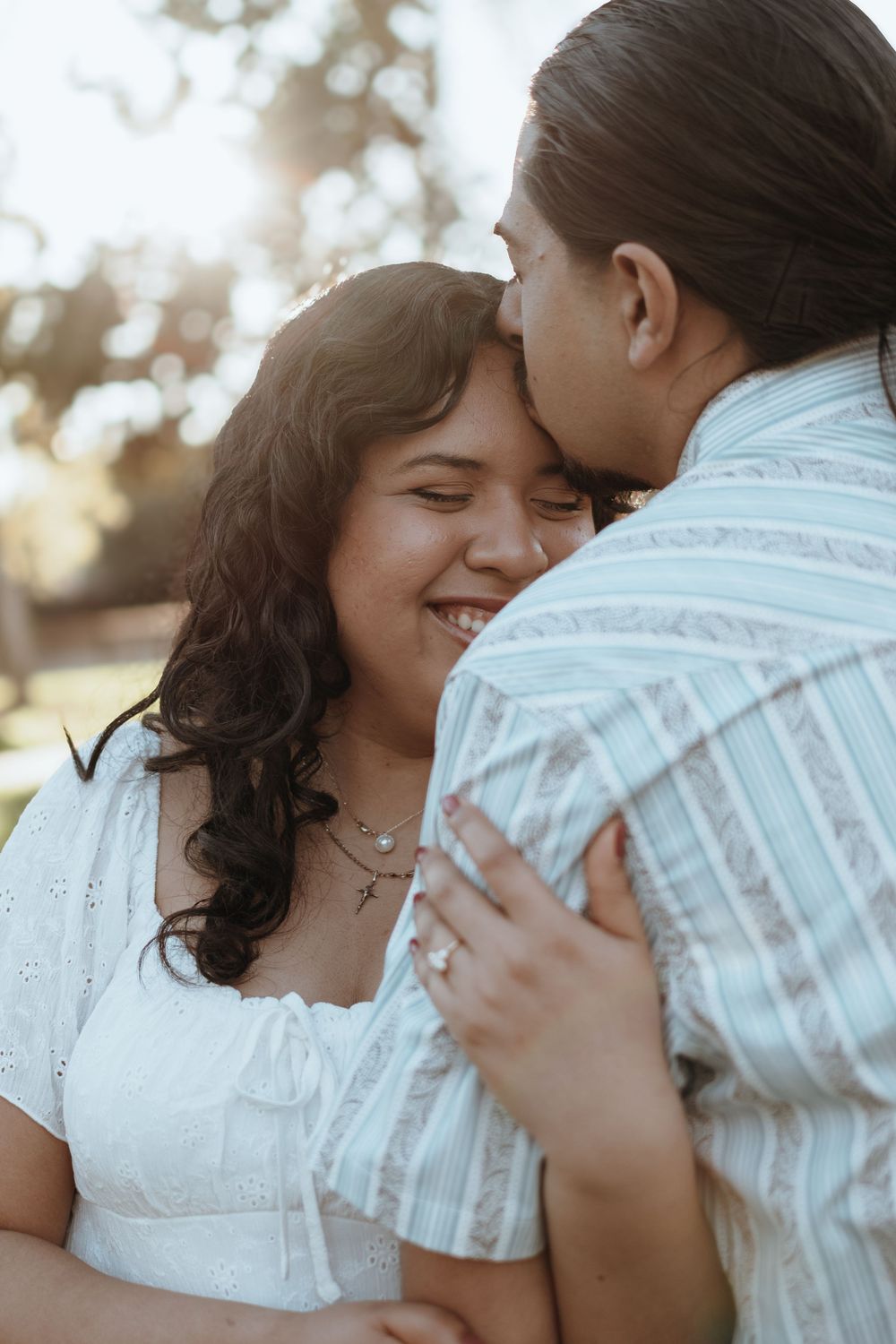 An intimate close-up of a couple sharing a tender moment during their engagement photos.