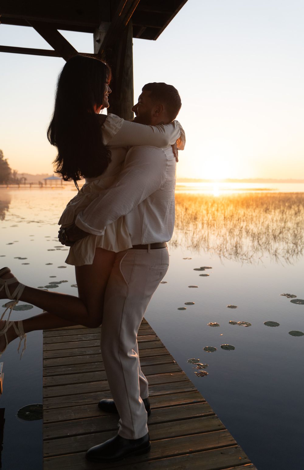 Orlando engagement session at a dock sunrise