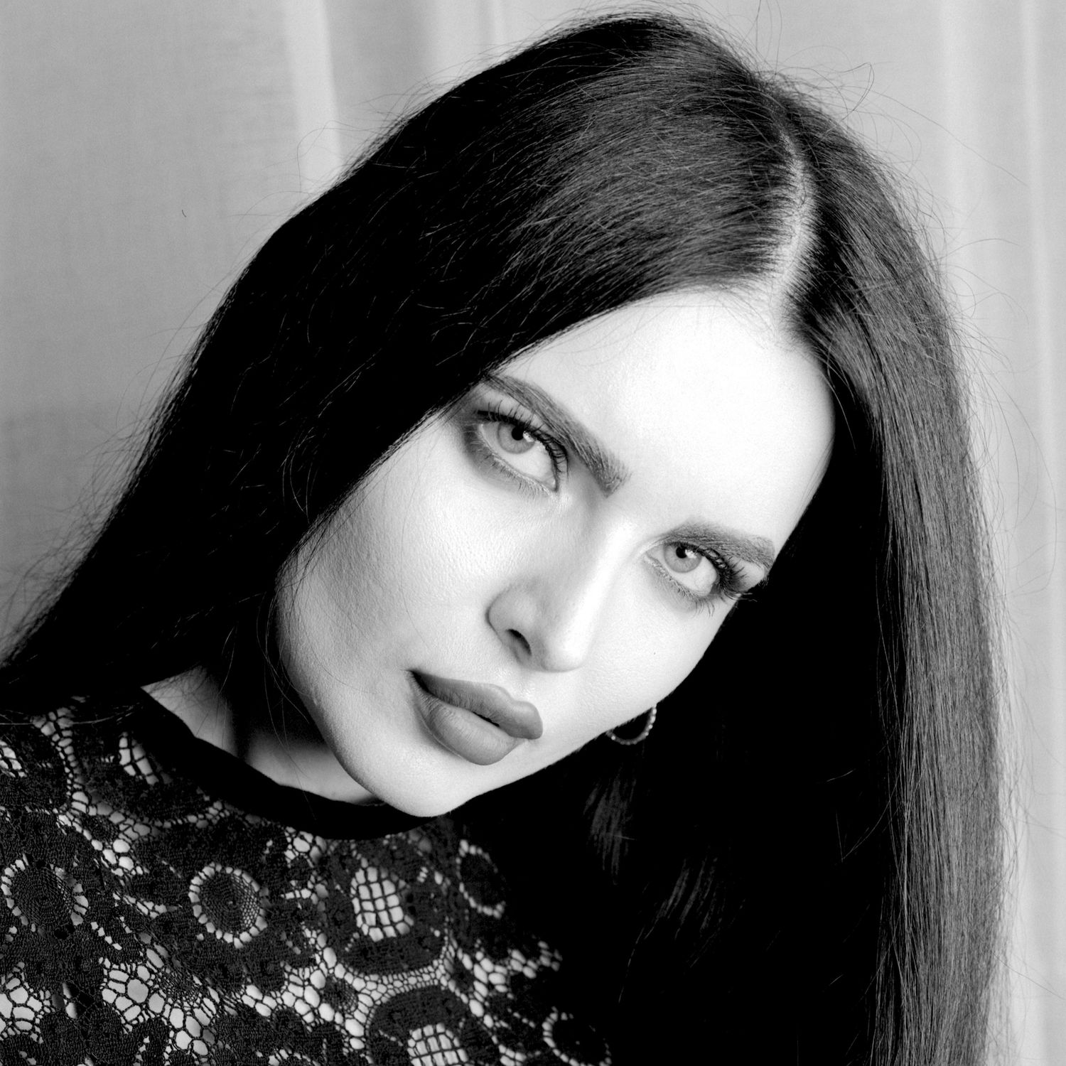 Black and white portrait of Volodina wearing Beautiful Creatures clothing