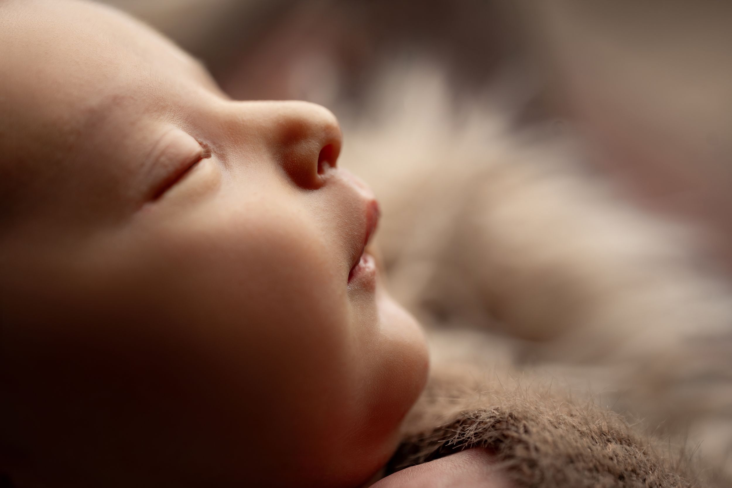 Timeless newborn photography capturing baby's first days with beautiful heirloom portraits.