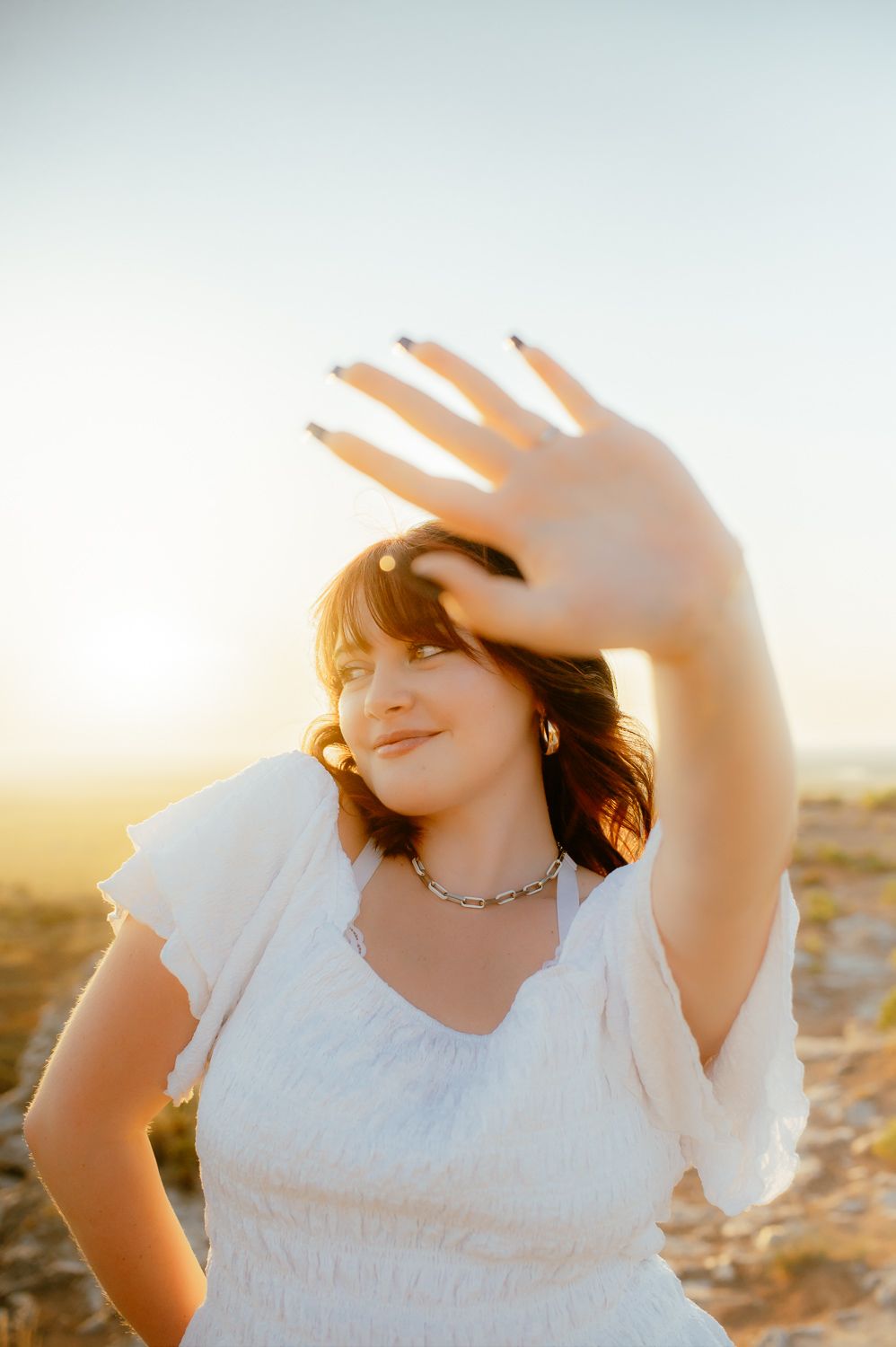 Close-up of senior girl wearing accessories for senior photos Enid OK.