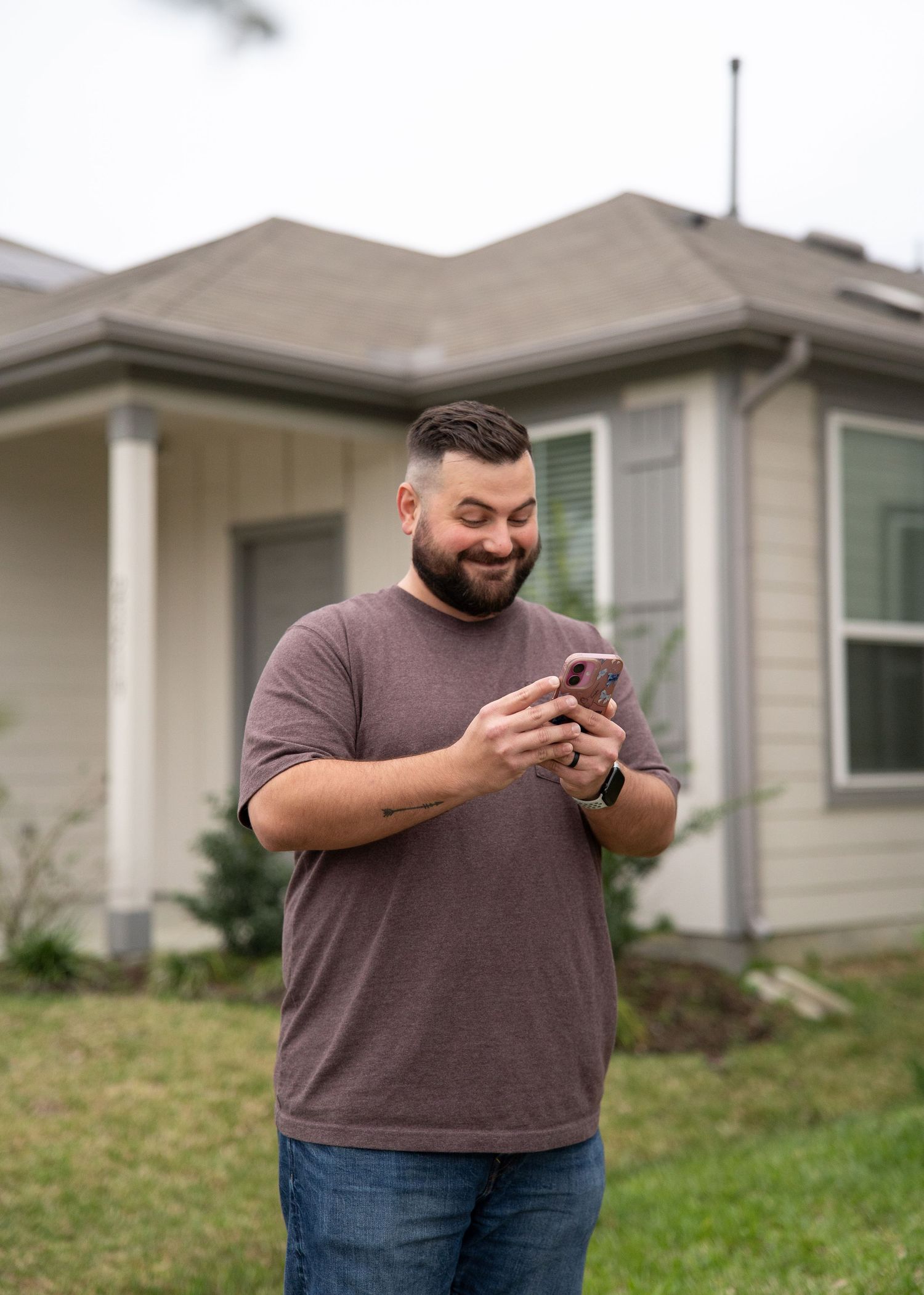 Dad reading gender reveal results to the family while kids excitedly wait to hand Mom the correct bouquet