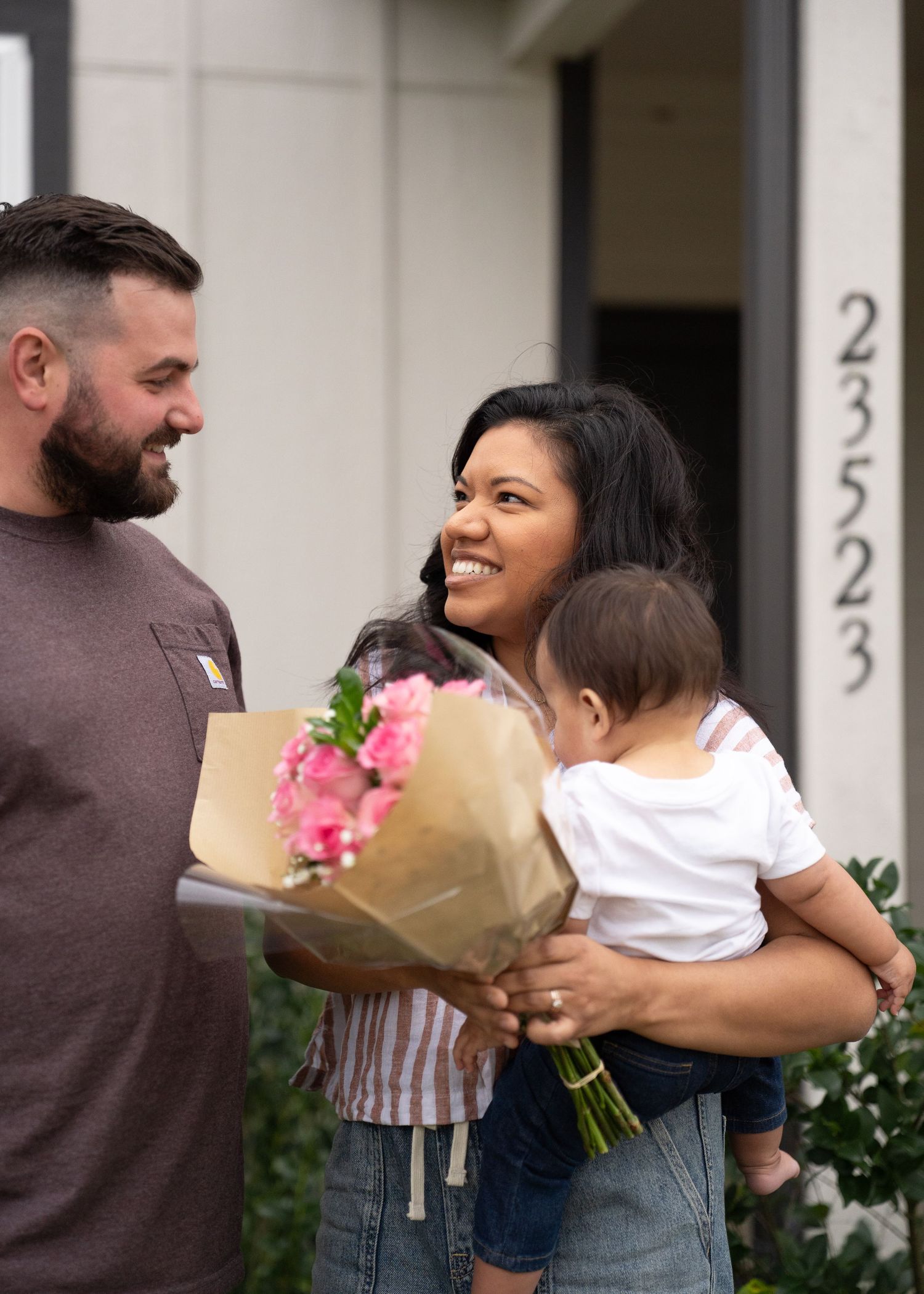 Emerson Family laughing together during gender reveal session in their North Houston home