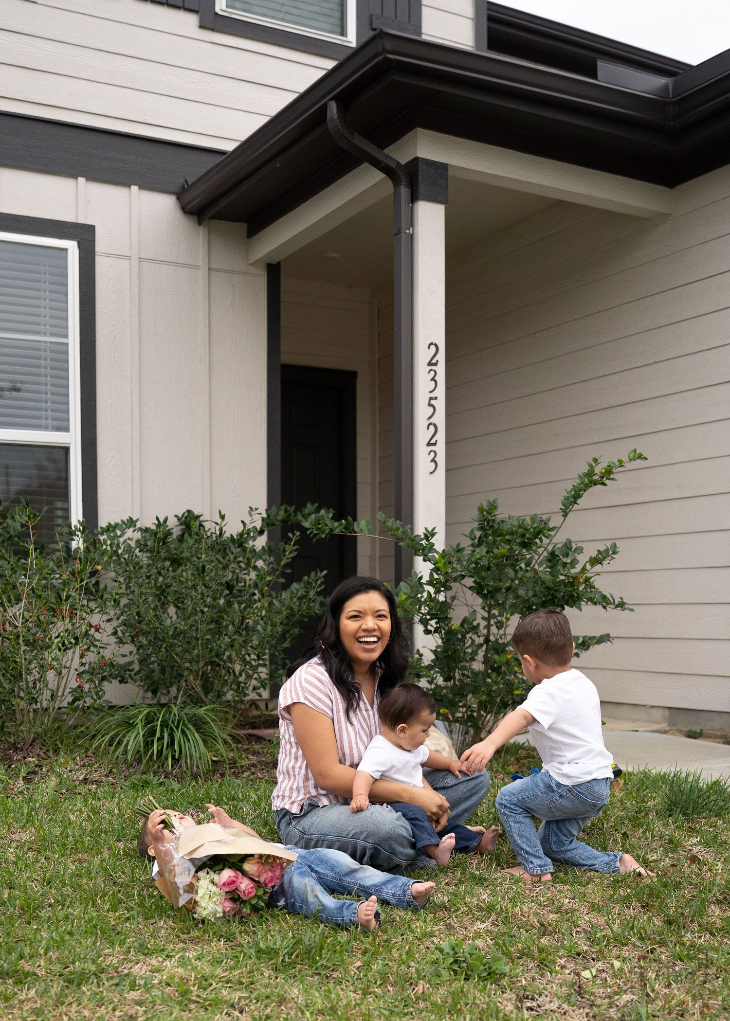Emerson Family laughing together during gender reveal session in their North Houston home