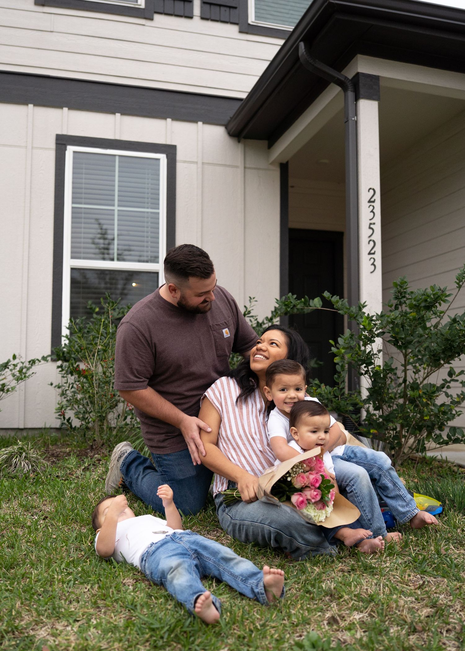 Emerson Family laughing together during gender reveal session in their North Houston home