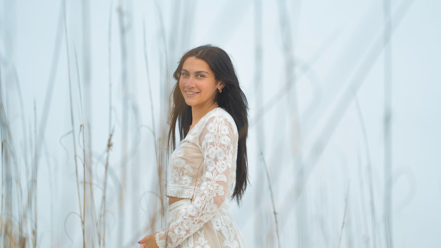 Elegant beachside photo collection with white lace details and natural lighting.