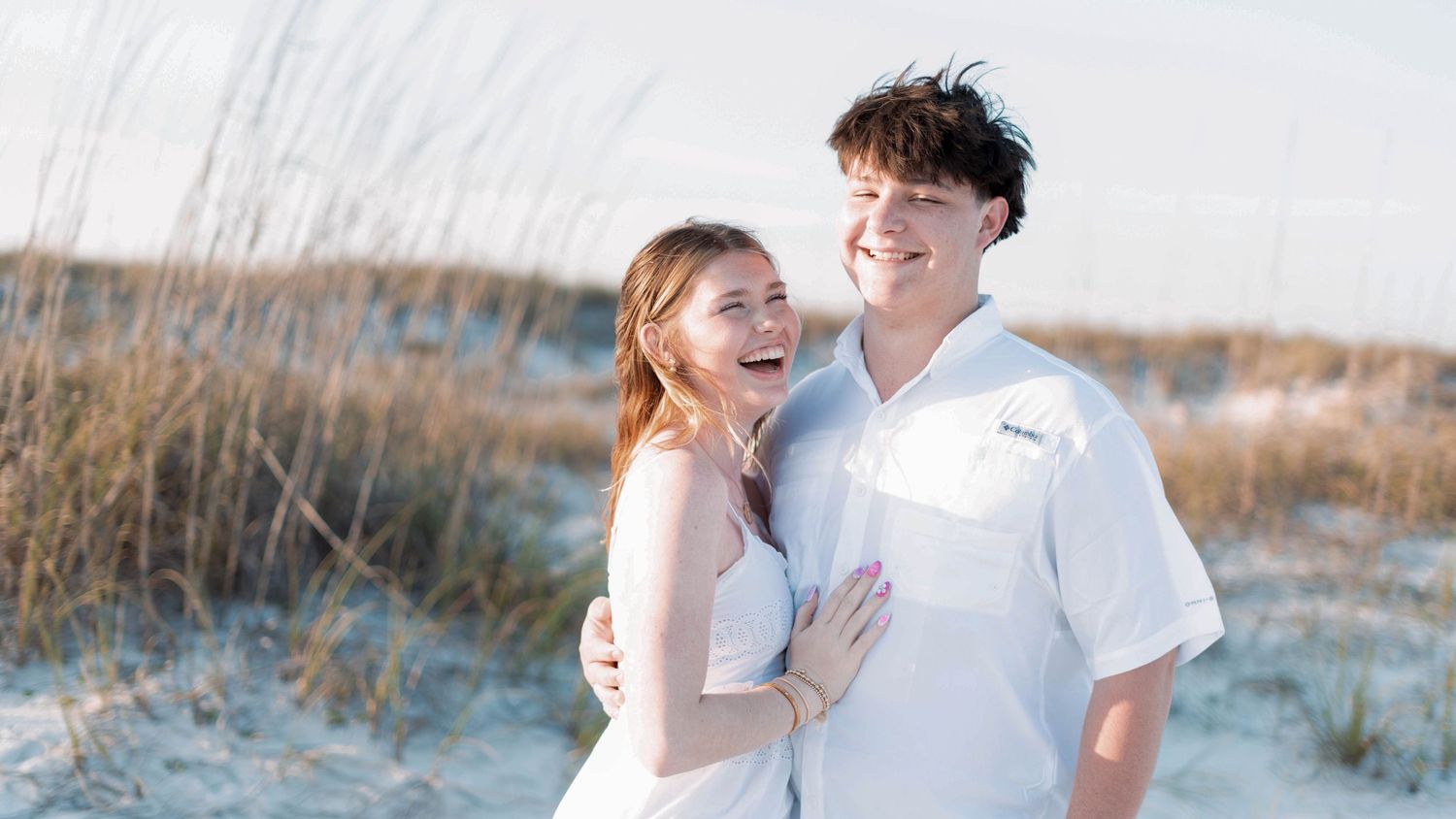A couple shares romantic moments together on a beach at sunset, captured in a series of candid photographs.