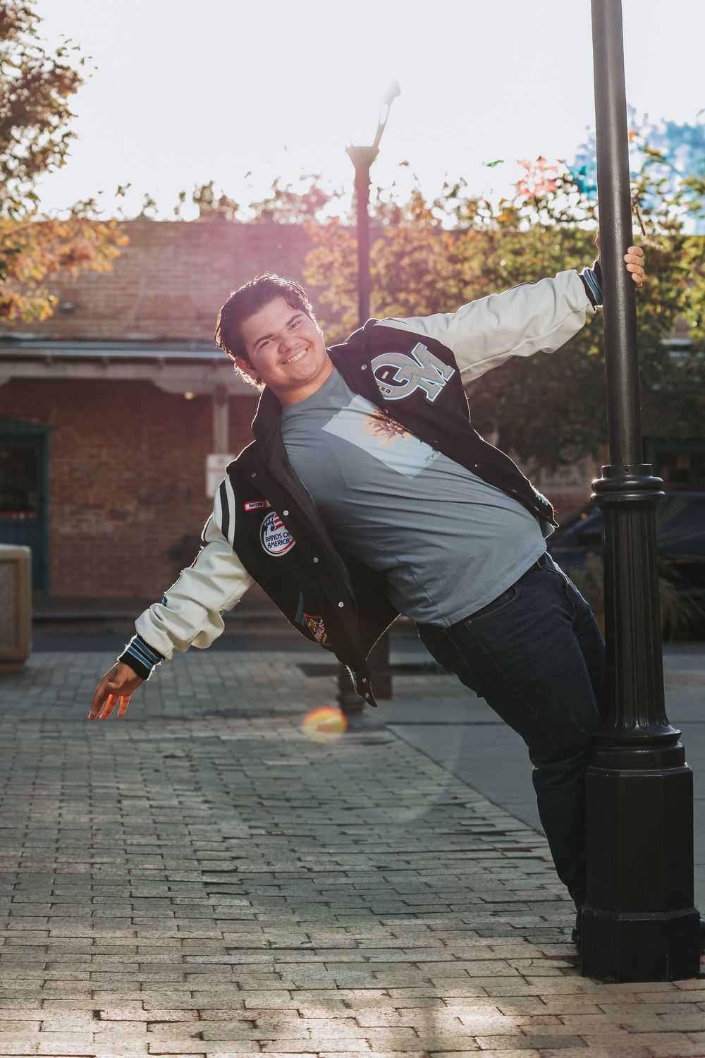 A sequence of photos showing someone performing a breakdancing windmill move on a brick patio.