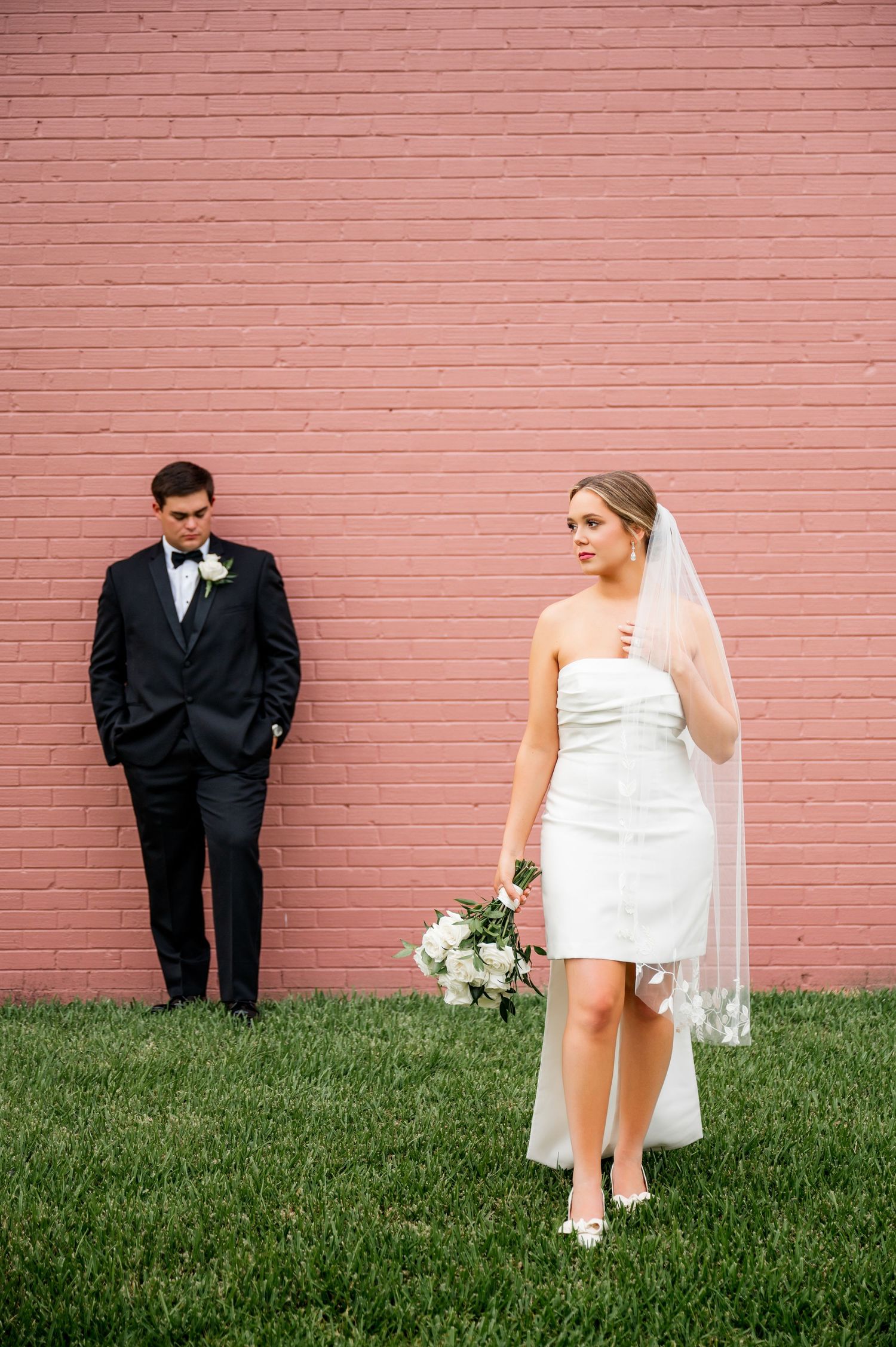 Artistic wedding photo sequence against a pink brick wall and grass.