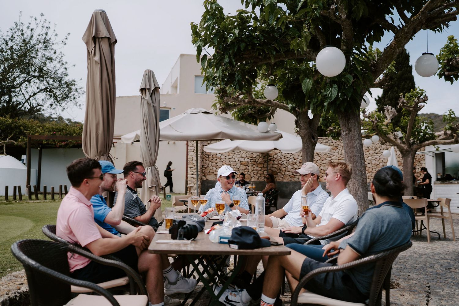 groom and groomsmen having drinks after golf at golf ibiza