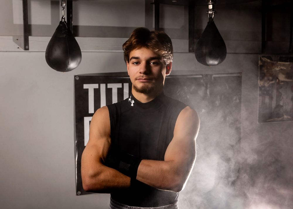A series of dark atmospheric boxing gym photos showing training equipment and smoky lighting effects. - senior photos in Omaha, NE