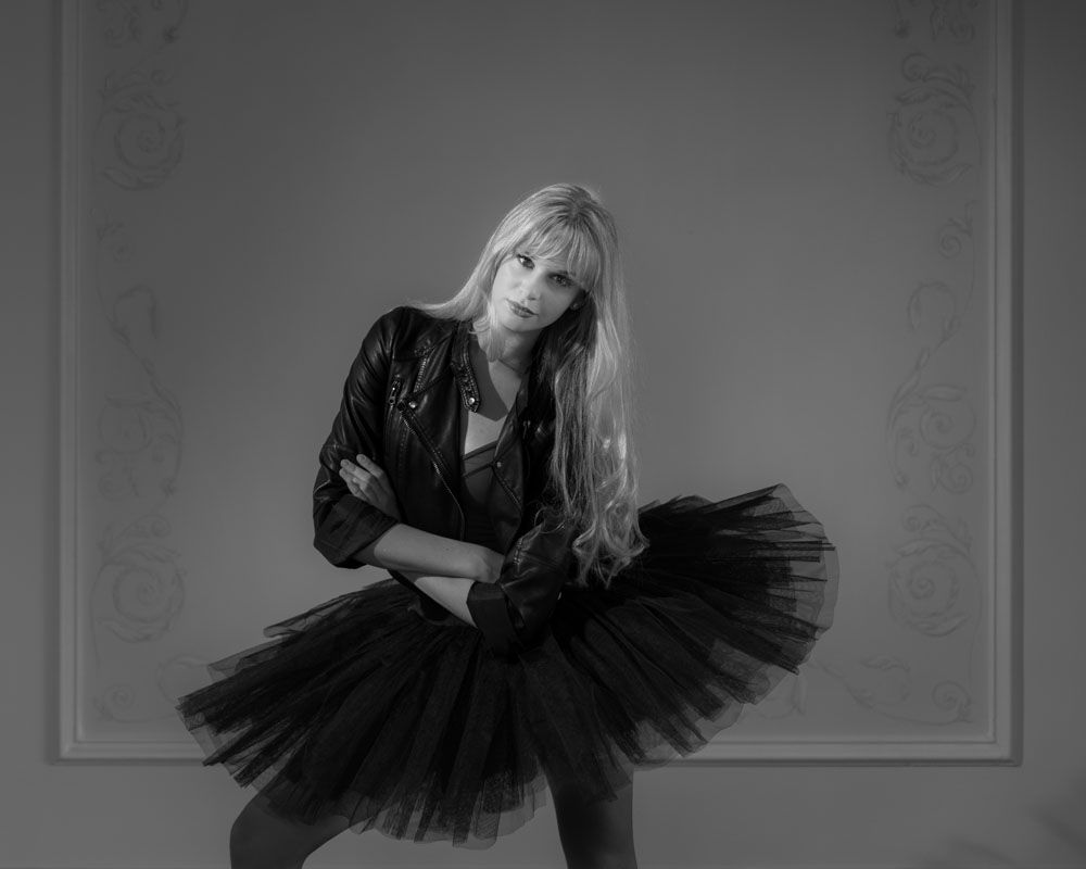 Striking black and white shot of ballerina with black tu tu