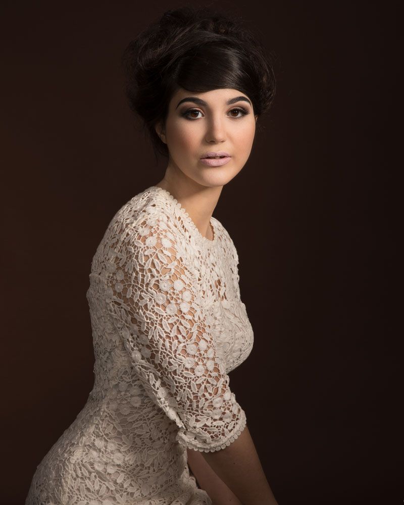 Stylish portrait of young woman looking candidly