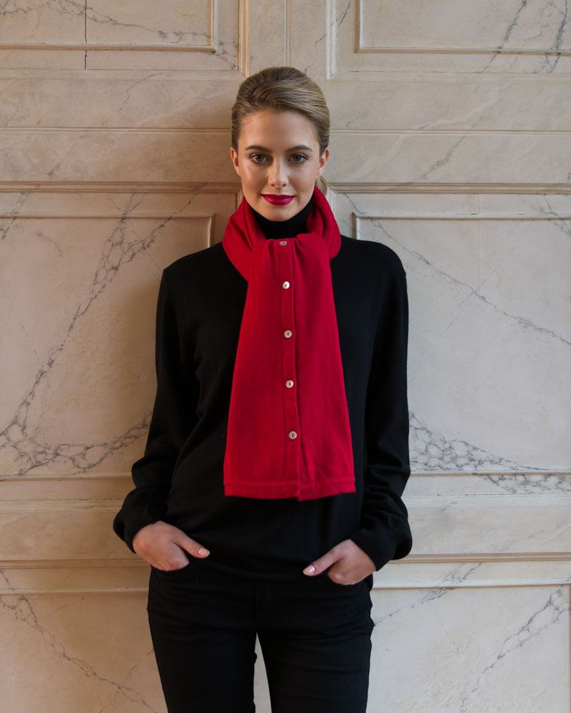 Stylish and fashionable young woman poses in country house