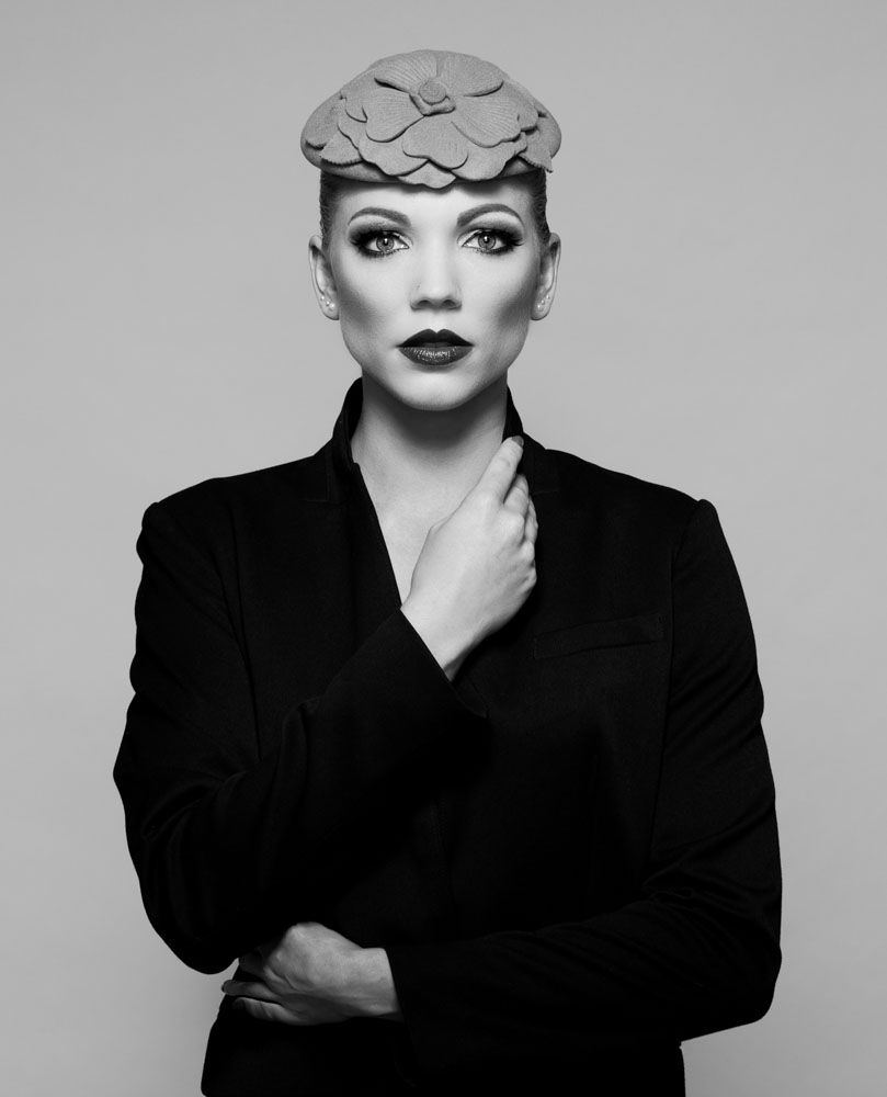 Very stylish black and white shot of young woman fashionably dressed