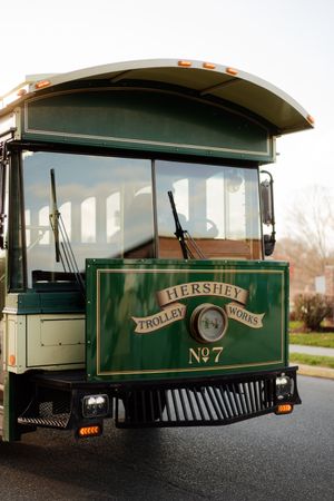 Vintage green Hershey trolley cars lined up showing their numbered exteriors and classic design details.