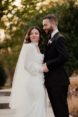 Romantic golden hour wedding portraits with flowing white dress.