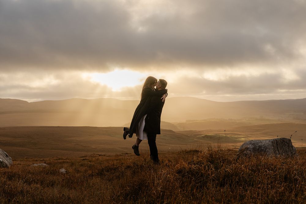 Couple in golden autumn landscape in Connemara, Diamond hill
