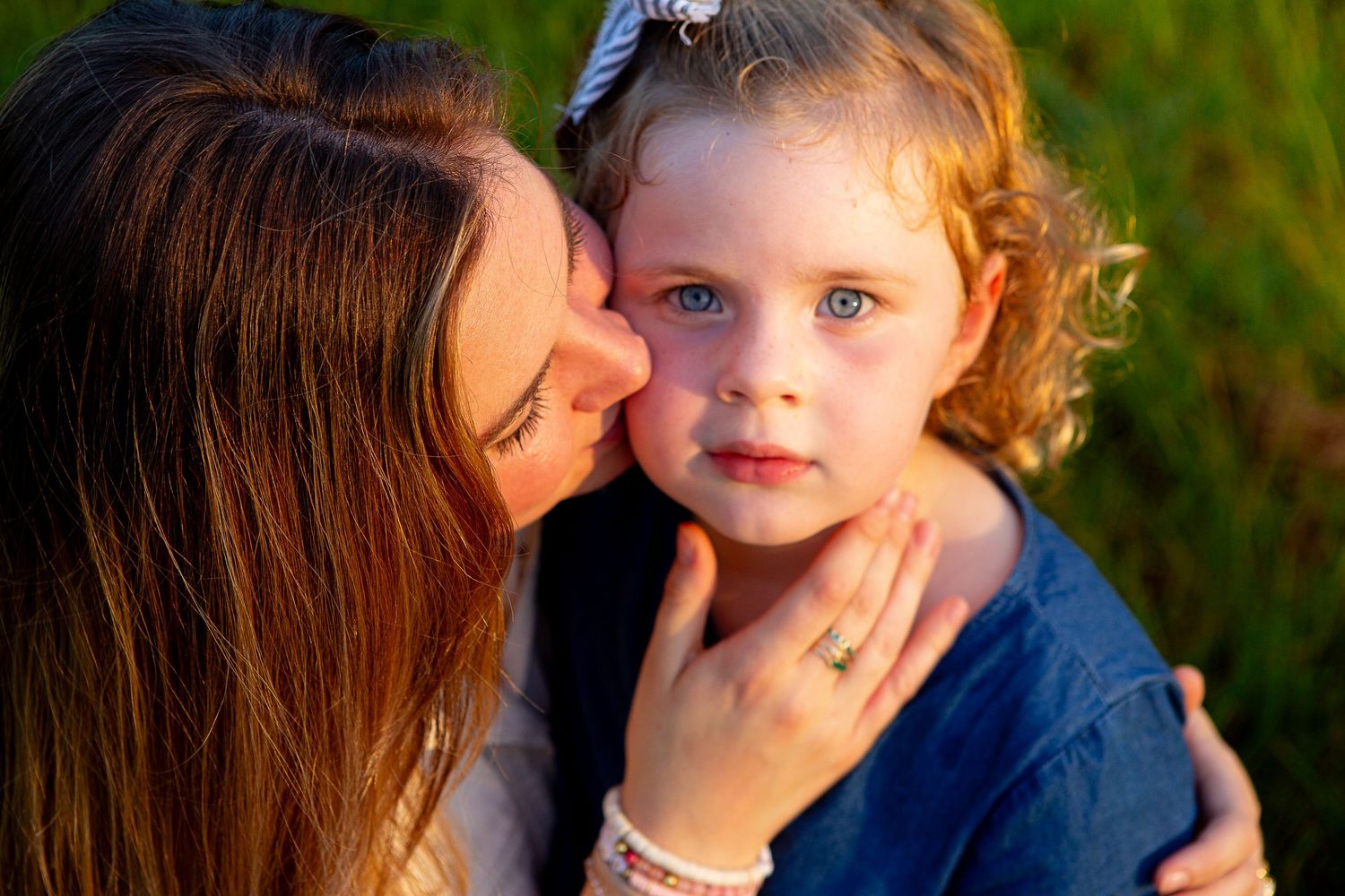 Detail shot of mom and child snuggling during outdoor photoshoot North Carolina