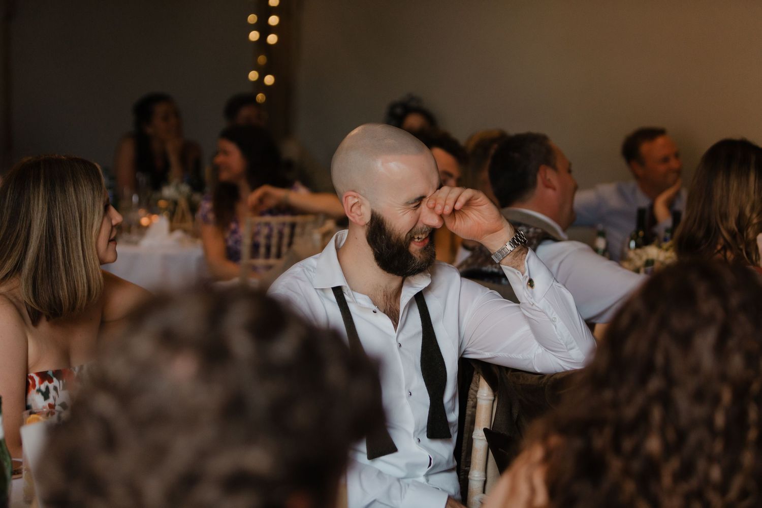 A sequence of candid wedding reception moments showing dancing, laughing and celebrating guests in an indoor venue.