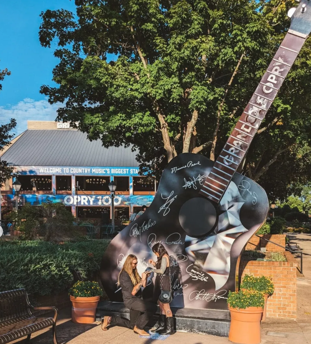 Photo of a couple getting engaged at the Grand Ol Opry