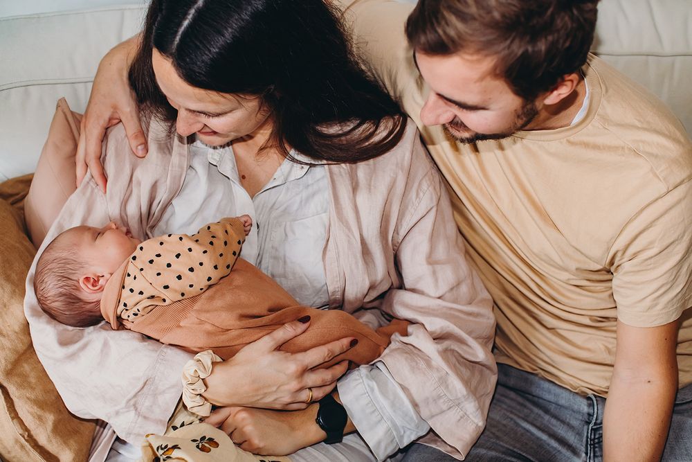 Tender moments captured in a series of intimate family photographs showing hands and gentle embraces.