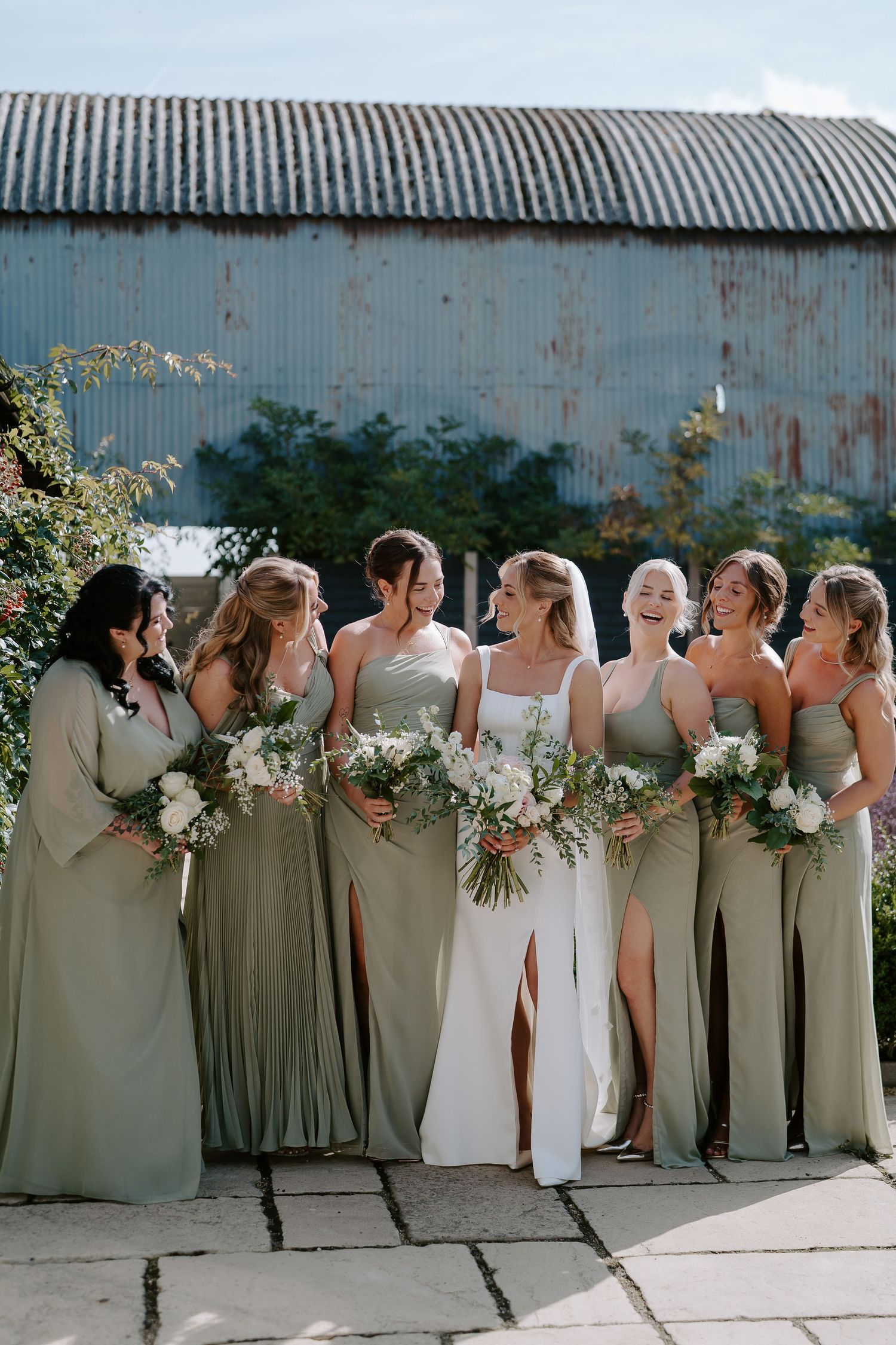 bride and bridesmaids portrait at ivy lodge in cirencester