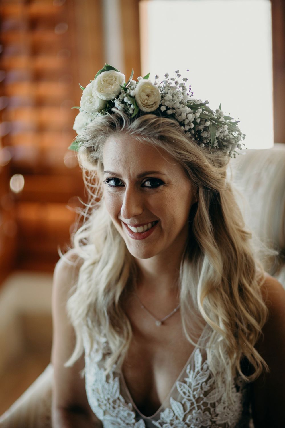 A series of romantic bridal portraits showing a floral crown and lace wedding dress in a rustic indoor setting.