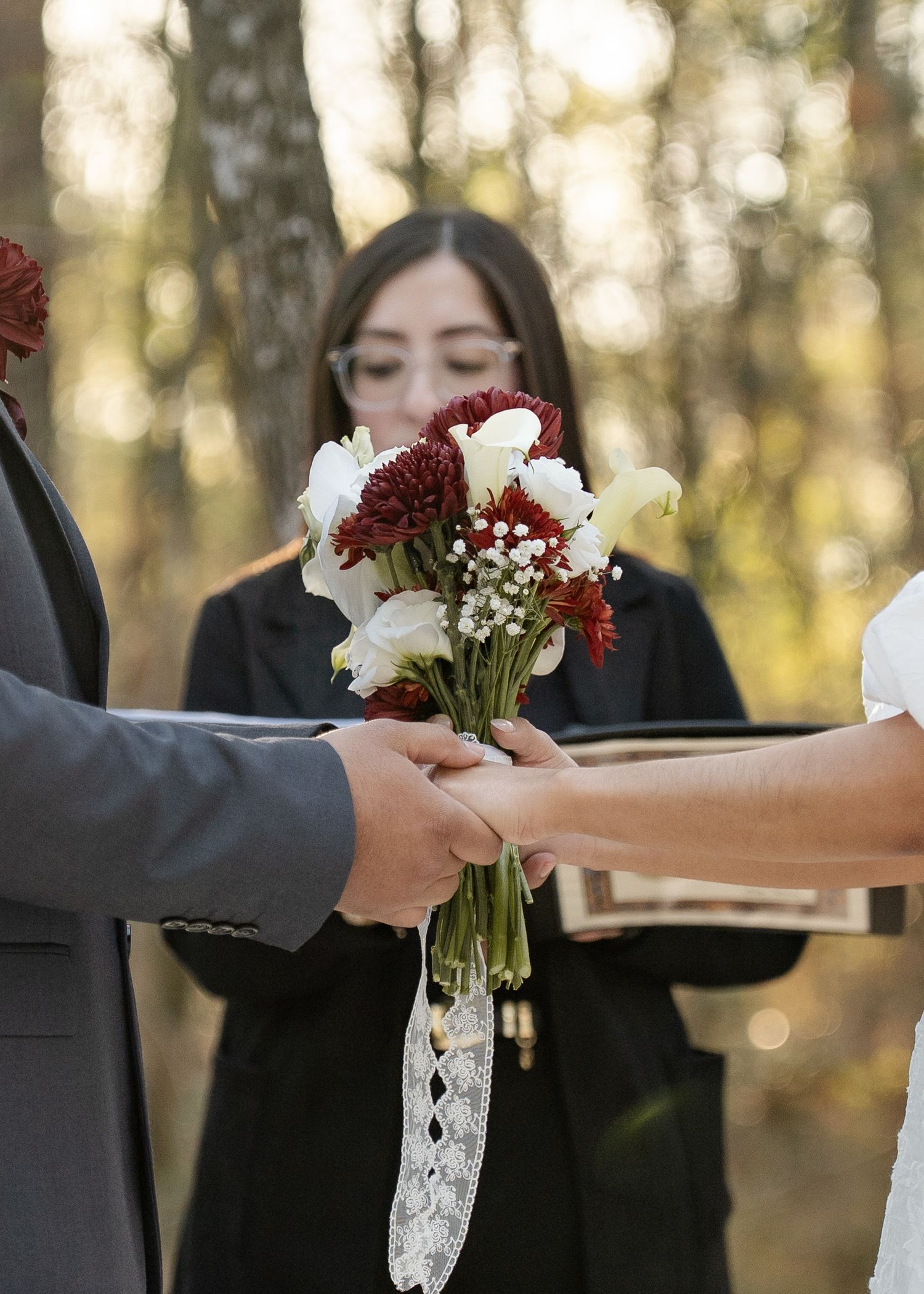 Twilight elopement ceremony of the Barrillas Family in Montgomery TX, with warm, moody light