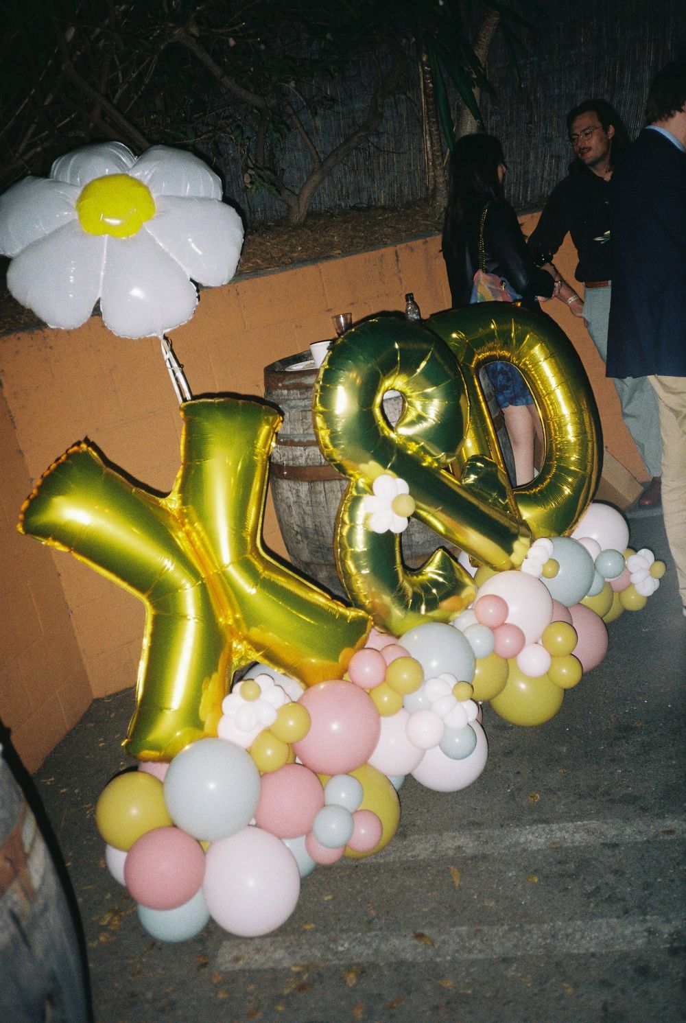 Balloons captured on 35mm film showcasing the couples wedding colors and initials X and D.