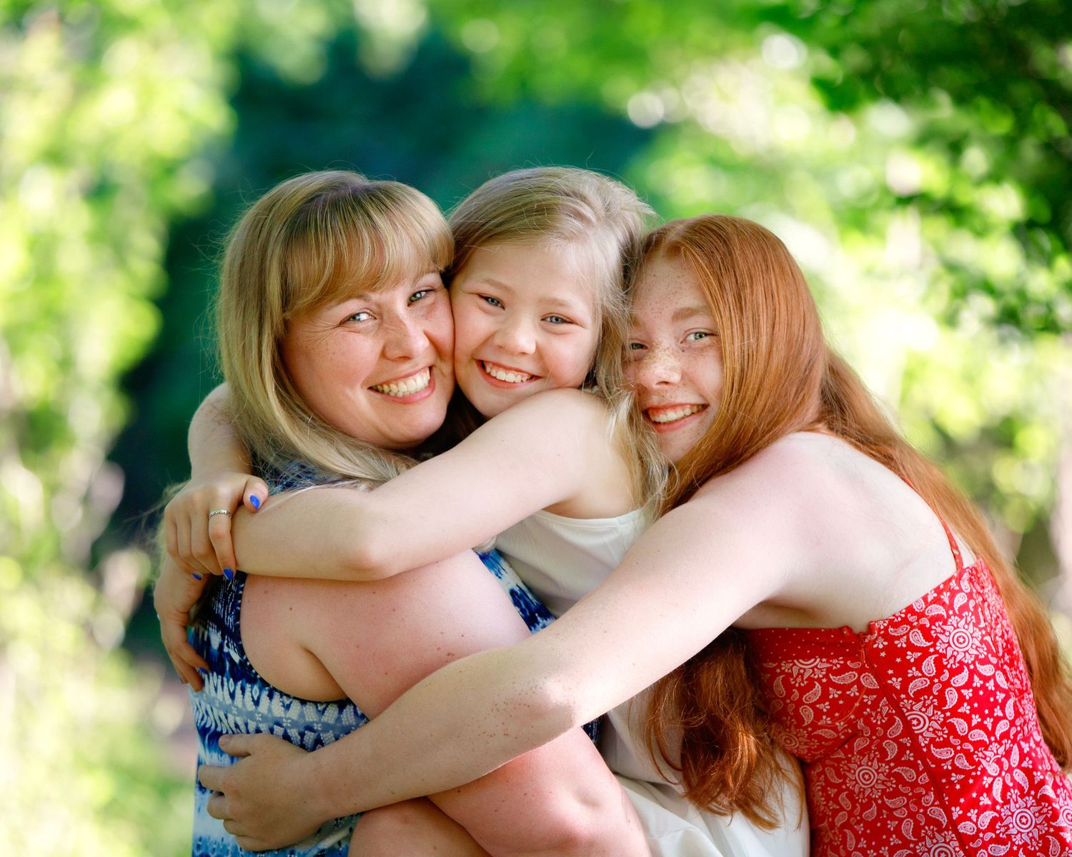 Bergen County Family Photographer captures mom and daughters hugging
