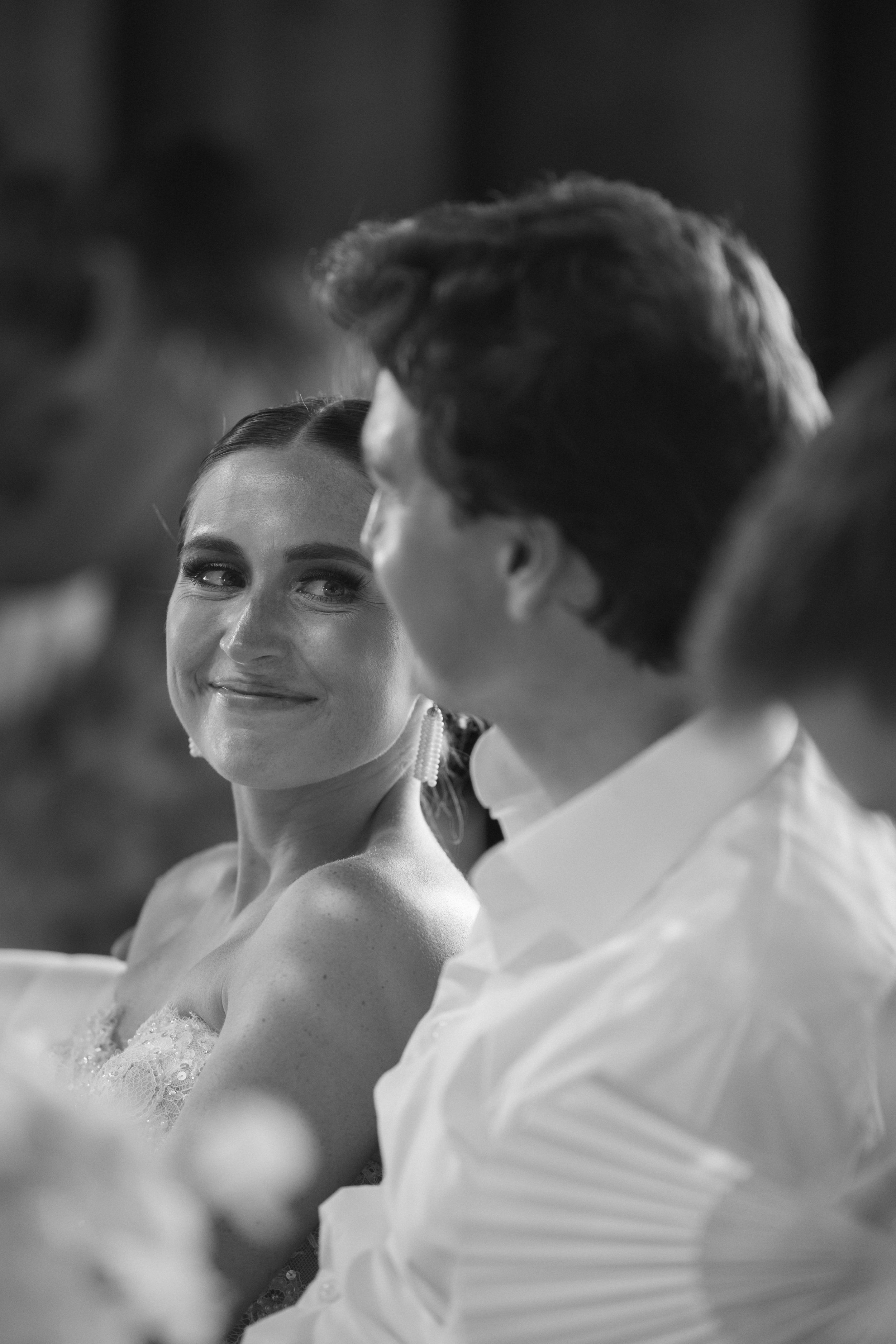 A romantic wedding portrait sequence showing a couple gazing at each other in black and white photography.