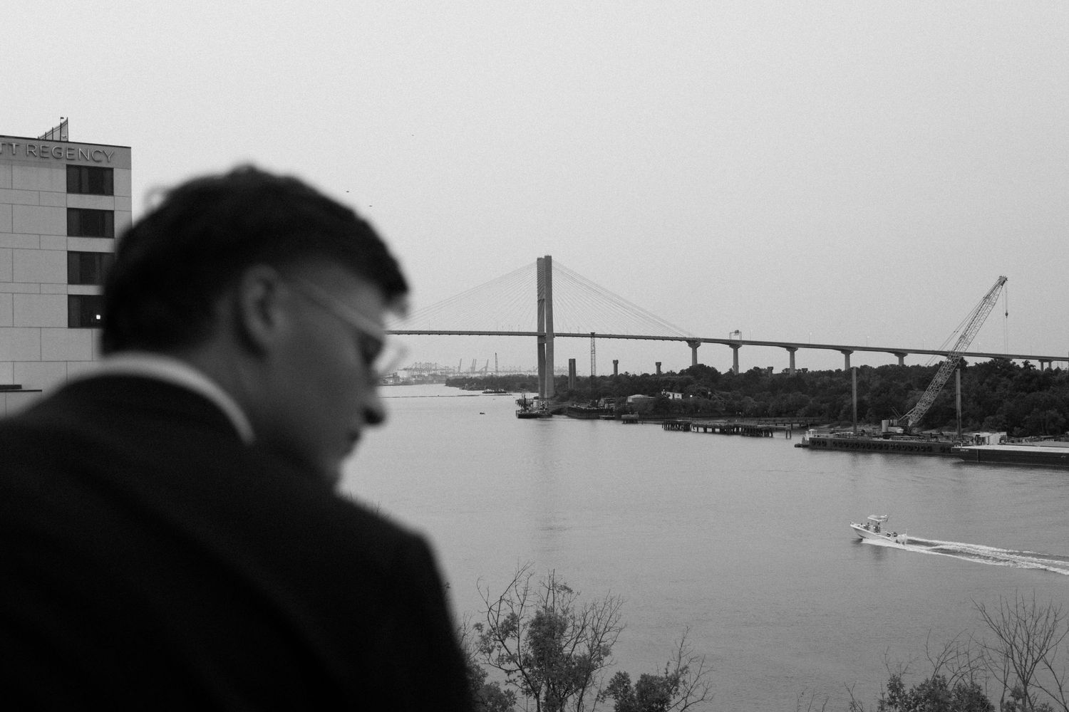 A series of black and white photographs showing ships and industrial harbor views along the waterfront.
